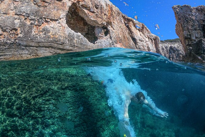 Cave exploring by kayak - Following the rugged coast toward the cave