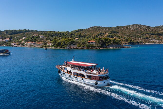 Dubrovnik: Elaphiti Islands Full-Day Cruise with Lunch - Koločep: pine trees, clear water, and a short first stop