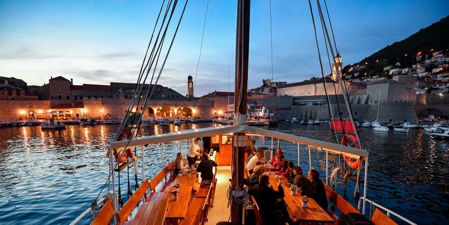 Dubrovnik: Panoramic Sunset Cocktail Cruise Around Old Town - The first cocktail and the Old Town walls