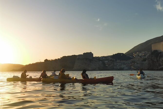 Dubrovnik: Sunset Kayak & Snorkel Tour with Wine & Water - Returning toward Dubrovnik’s Old Town