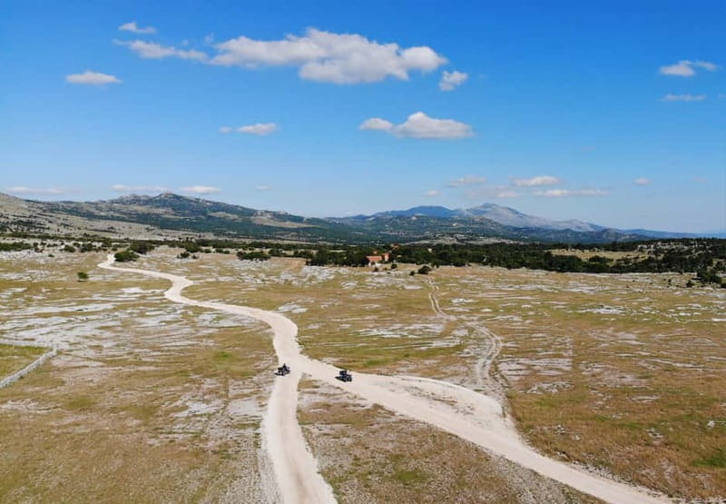 From Split: Dinara Nature Park Quad Adventure with Swimming - Mountain views, old bunkers, and local stories