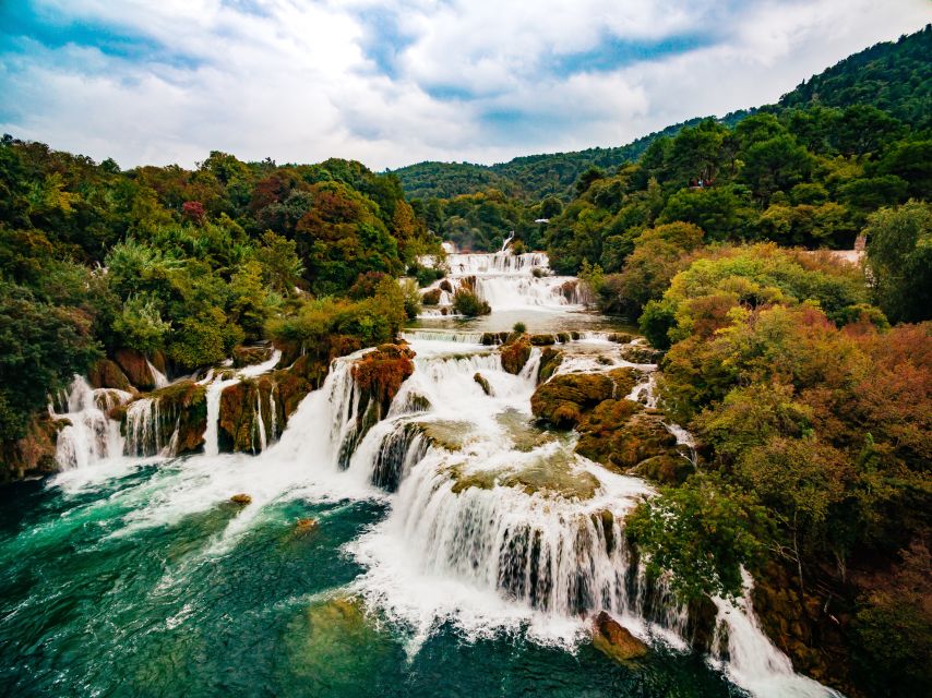 From Split & Trogir: Krka Waterfalls Day Tour with Boat Ride - Walking the Skradinski Buk trails