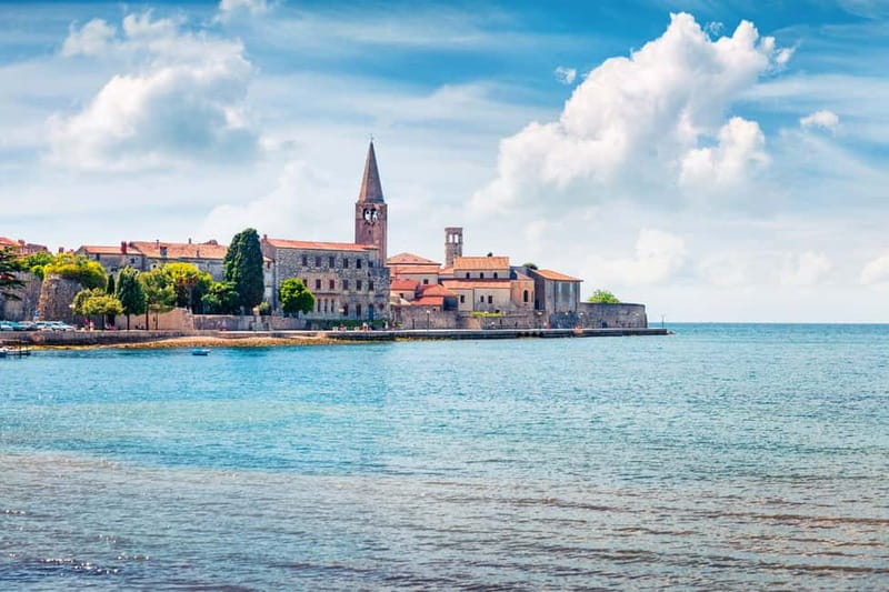 From Umag: Day Cruise to Poreč with Lunch and Swimming - Lunch back on board, with wine and a local welcome drink