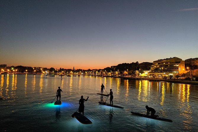 Glowing Stand-Up Paddle Experience in Split - White rocks, cliffs, and traditional shore houses