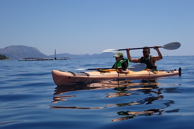 Kayaking Korčula's Paradise -Half Day Guided Kayak Tour - Walking, stonework, and local stories