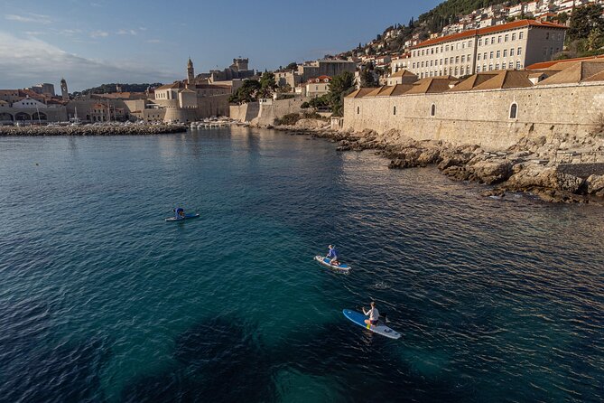 Lokrum Paddleboarding & Snorkeling Adventure; Caves and more - Paddling toward Dubrovnik’s old walls