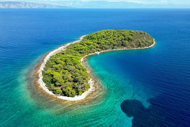 Makarska: 3-Island Speedboat Tour with Cave and Blue Lagoon - Swimming into the blue cave at Pokrivenik
