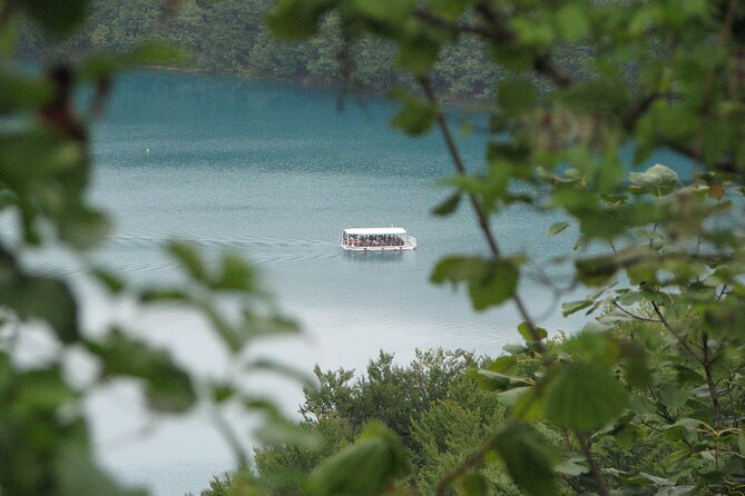 Plitvice Lakes Private Guided Walking Tour - Boat rides, panoramic trains, and a circular route