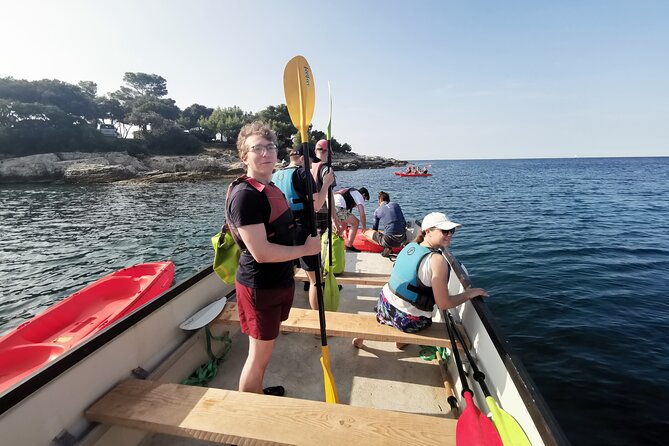Pula Boat & Kayak Adventure - Paddling into the large sea cave