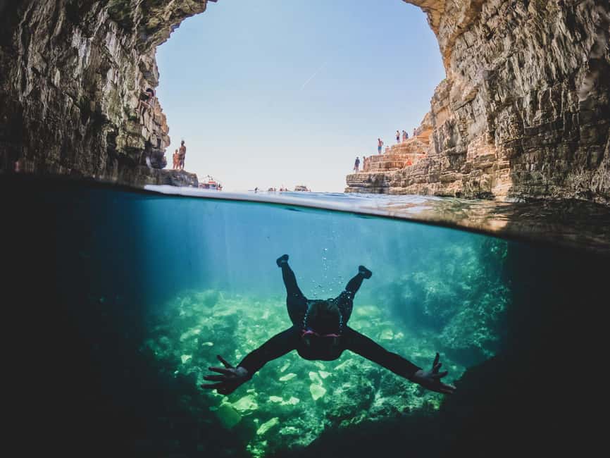Pula: Kayaking,Snorkeling, Cliff jumping Tour with Wetsuit - First water stop: swimming, snorkeling, and sightseeing