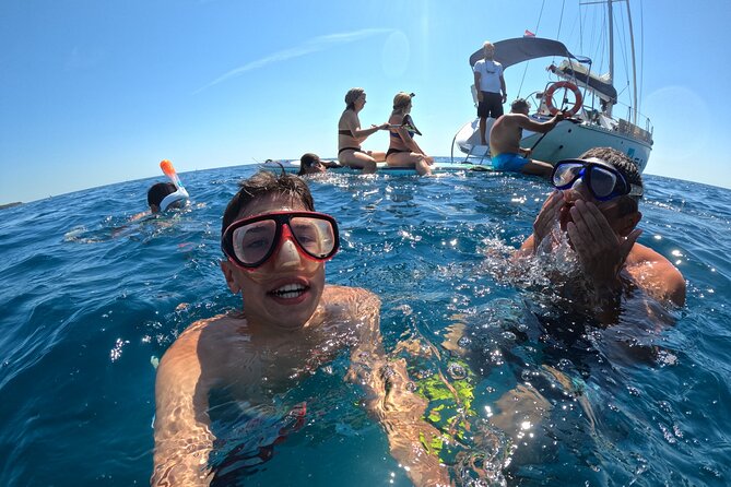 Pula Private Sailing Tour: 4-Hour Customizable Sail, Snorkel, SUP - Swimming and snorkeling in an Istrian bay
