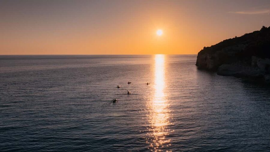 Pula:Sunset Kayak tour with glowing transparent kayak - Returning slowly as the coast darkens