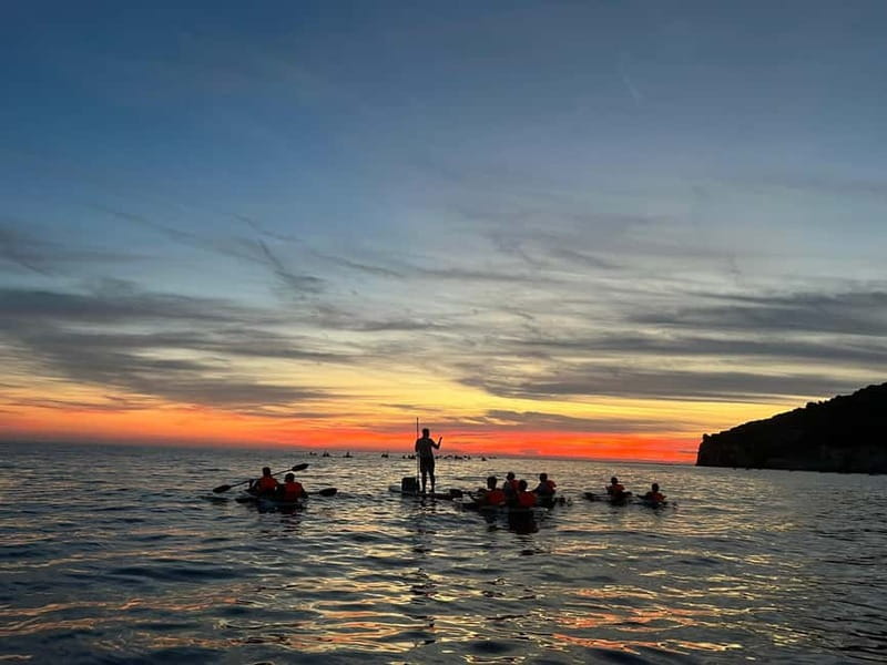 Pula: Sunset/Night Illuminated Transparent Kayak Tour - Paddling over clear water at sunset