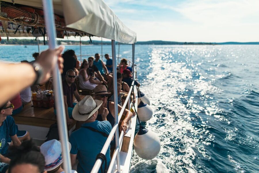 Rovinj: Sunset Cruise with Swim Stop, Drinks, and Fruits - Sunset views and old-town Rovinj from the sea