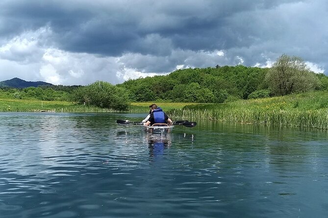 See through kayaks on Gacka river - Three bridges provide brief landmarks and little shade