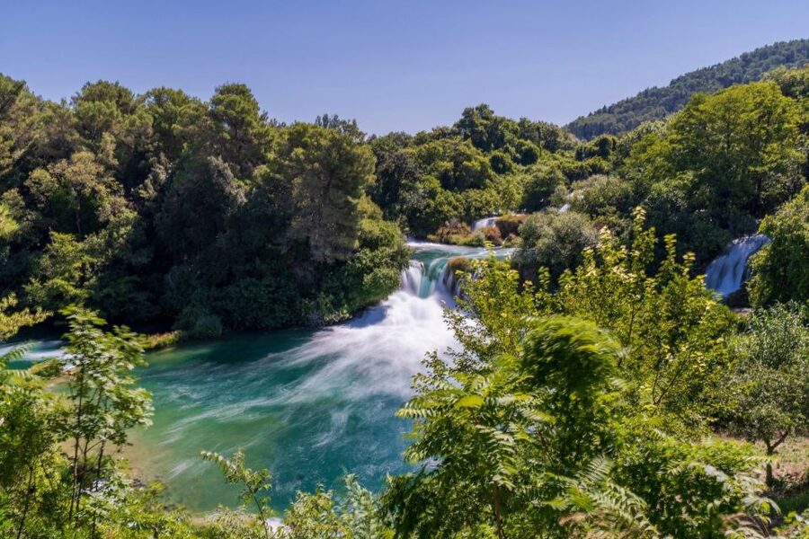 Split: Krka Waterfalls With Boat Cruise, Wine and Olive Oil - A calm boat ride on the Krka River