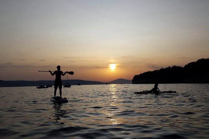 Split Sunset Stand Up Paddle Tour - Learning to stand on the board