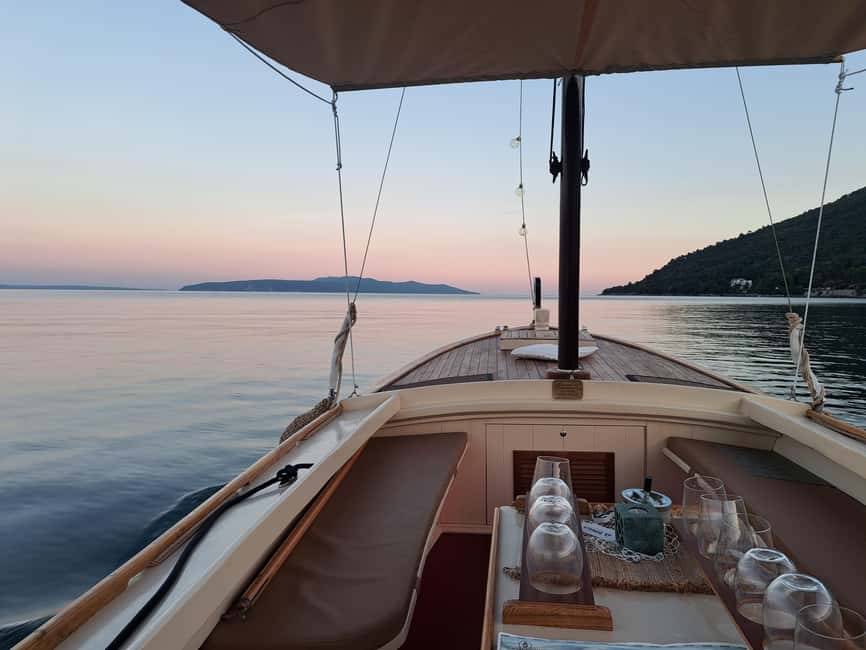 Sunset or Swim Ride Opatija on Madonnina Boat Tour - Sailing toward Volosko with a guide at the helm