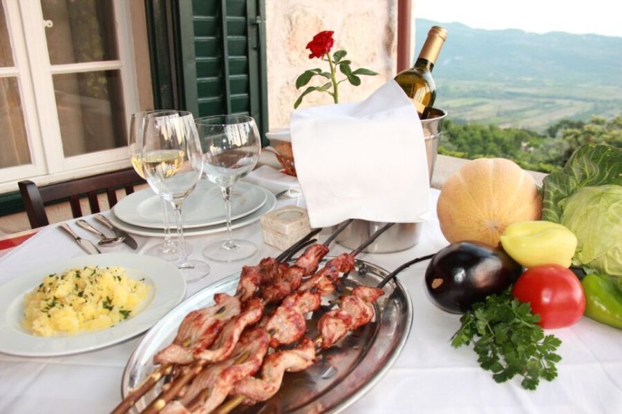 Traditional Dalmatian Cooking Class from Dubrovnik - Picking vegetables, milking a goat, and meeting the farm